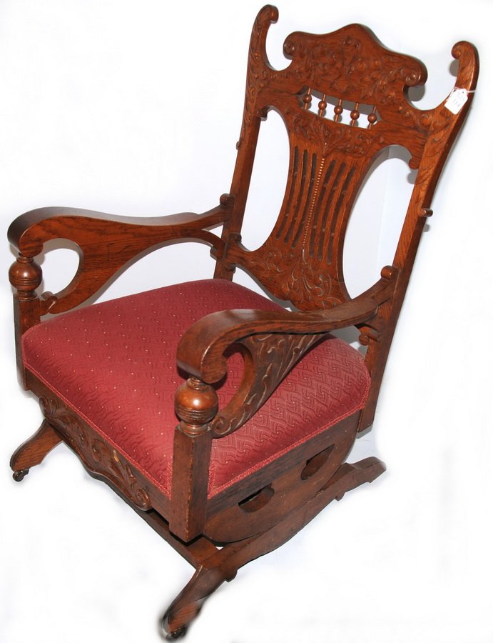 Oak ornate platform rocker with upholstered seats: Oak ornate platform rocker with upholstered seats