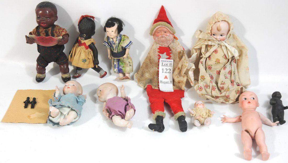Collection of small antique dolls to include a Ce: Collection of small antique dolls to include a Celluloid Wind Up Black Americana Boy Eating a watermelon, full bisque Japanese baby Doll, full bisque Cupie Doll, full bisque Made in Japan Black Americ