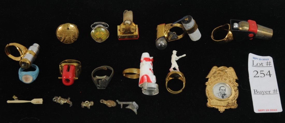 Collection of 1950's Decoder Rings including boot : Collection of 1950's Decoder Rings including boot compass ring, Cannon Ring, , Baseball Player Ring, Light Bulb and Chalk ring, Balls and Strikes Ring, Old Man of the Mountain Ring, Baseball Bubble Gl