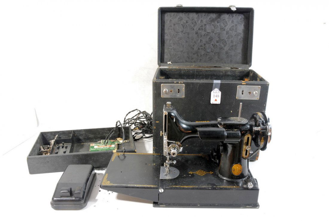 Singer Sewing machine in black case with Singer B: Singer Sewing machine in black case with Singer Buttonholer templates.Significant wear on top of case. Sewing motor catalog 3-110. 100-110 volts. 25 to 75 cycles.