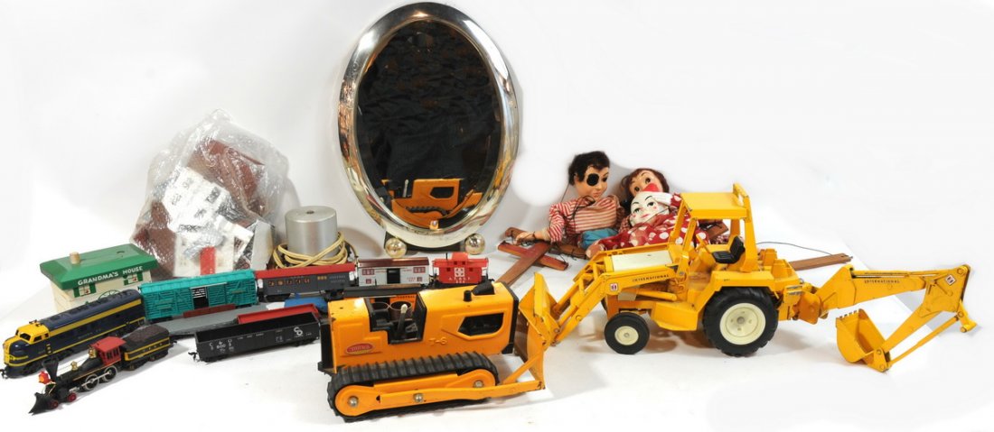 Box of Toys to include 3 Marionettes, Plastic Trai: Box of Toys to include 3 Marionettes, Plastic Trains, one Yellow Bulldozer, Yellow International Excavator, Oval Mirror and Chrome Frame