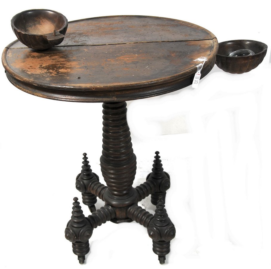 Victorian round table: Victorian round table with attached circular bowls and turned legs on wheels. 24x28 Exquisite piece! The top needs some work and attach the bowl.