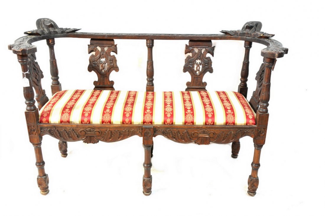 Important carved walnut six-legged settee: Important carved walnut six-legged settee. Crown of sculpted top rail flanked by two young girls faces with flowing hair. Five back supports, two supports have pierce-carved griffins flanking a center