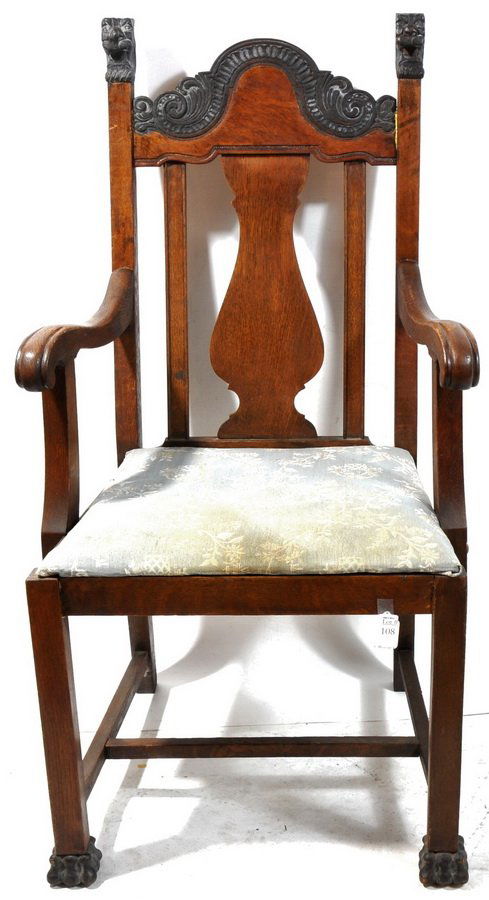 Oak Arm Chair: Oak arm chair with paw feet in front design back with figural heads 41.5" H x 21"