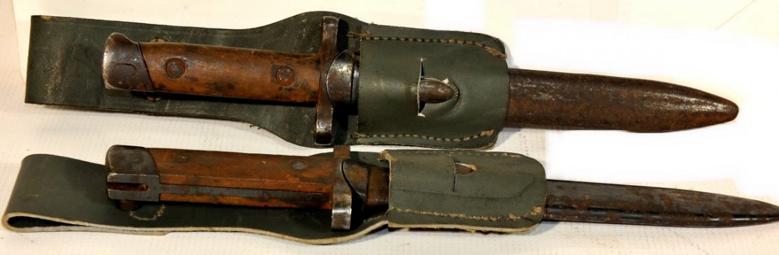 WW II and WW I Bayonets, includes 2 English Enfield 190: WW II and WW I Bayonets, includes 2 English Enfield 1907 bayonets with leather scabbards, 1 German Mauser 98 (Butcher Blade) made by Erfurt 1911 with steel scabbard, and 2 WW II M38 Carcano Italian ba