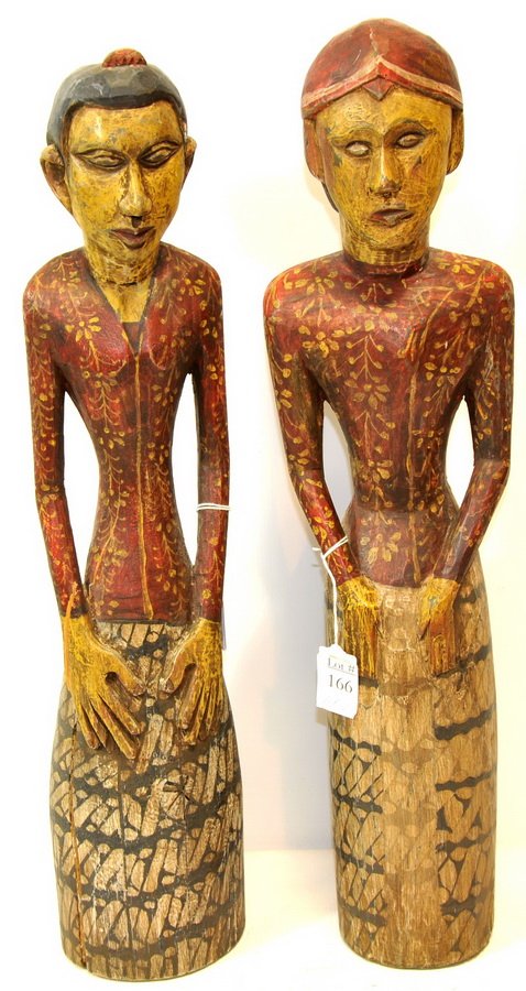 Pair of Antique Indonesian Carved figures(WP3): Pair of Antique Indonesian Carved figures used to ward off evil spirits outside of the home 22"