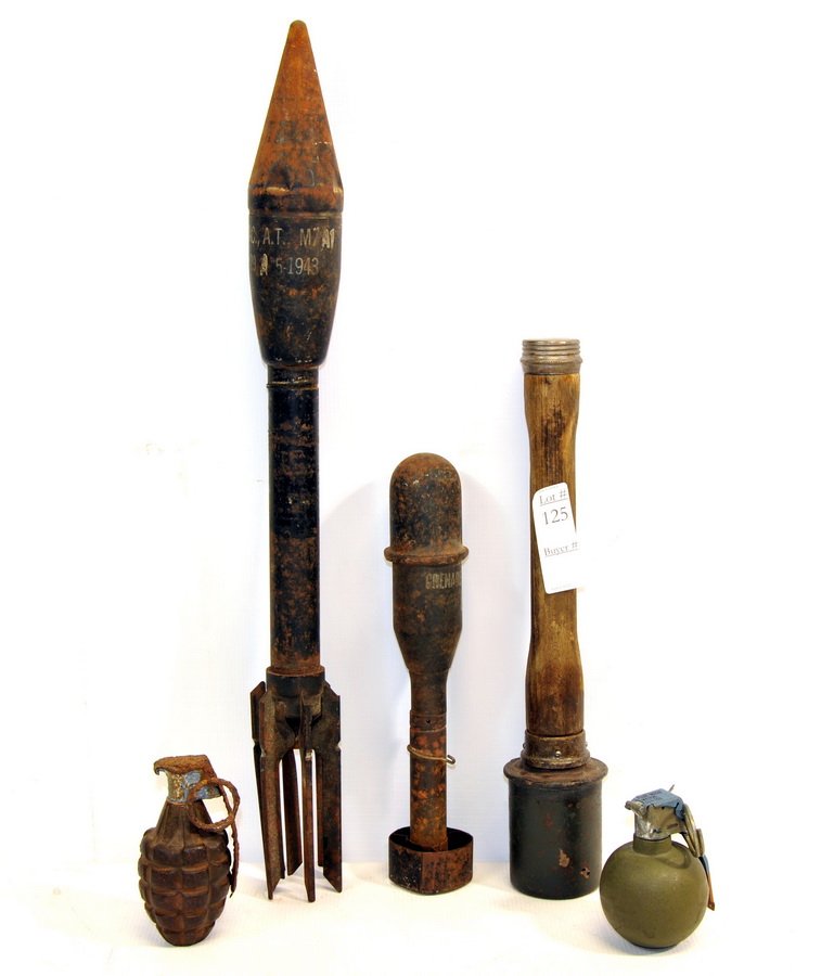 WW II Ordinance collection T1: Inert WWII US frag grenade, German stick grenade dated 1943, Practice M7 A1 Bazooka rocket, M11A3 Practice rifle grenade, modern practice baseball grenade.