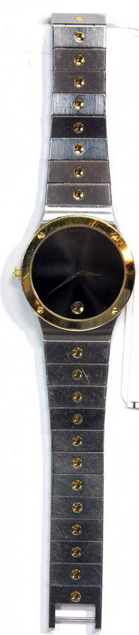 Mens Movado Stainless Gold & Silver Tone Watch: Mens Movado Stainless Gold & Silver Tone Watch in good running order with a stainless band