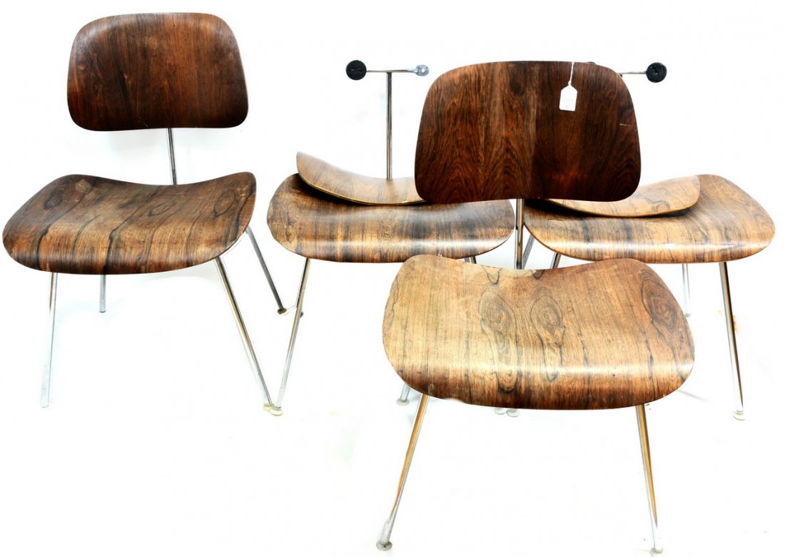 Set of four Eames LCM: (Lounge Chair Metal) molded plywood chairs with label underside: Herman Miller Furniture Company, Zeeland Michigan. Designer labels on two chairs: Charles Eames,20 x 19 x 30. Two chairs in need of rep
