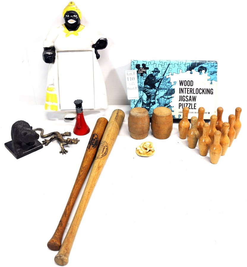 Misc collection of smalls: to include: brass cigar sign 6 x 12, Salesman Simplex Jack, Saco, ME fire badge, 3.5 carved wooden bear, 2 mini wooden bats, keys, bottle openers, marbles, harpoon spear head, 5" iron lizard signed Pe