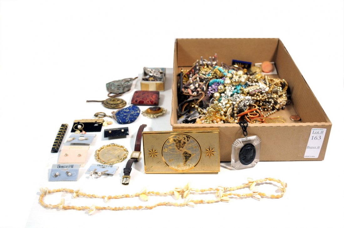 Bright colorful collection of costume: jewelry with beaded necklaces, lockets, pins, earrings and small change purses.