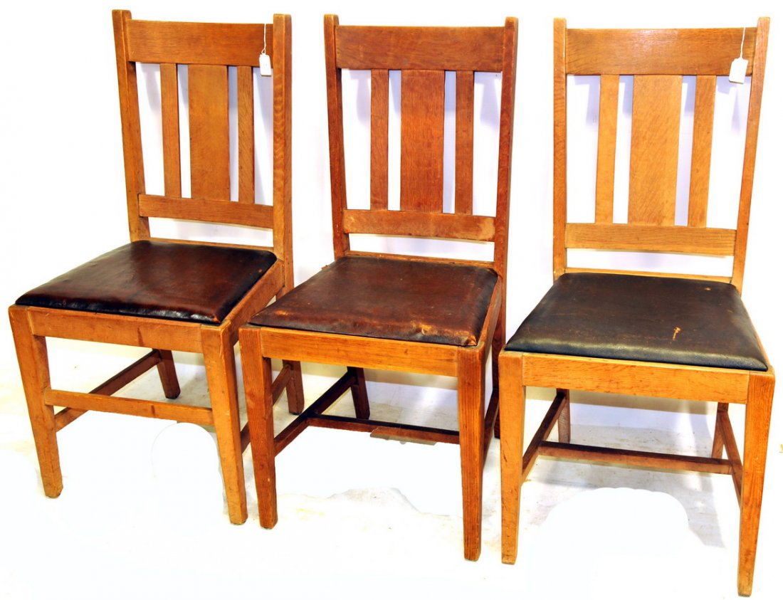 Three New England Oak Mission: T-Back chairs with original leather seats. Signed and made in Keene New Hampshire, c. 1910-1925.