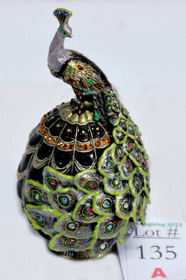 Jewel Decorated Peacock Egg: Jewel decorated Peacock sitting on a jewel encrusted enamel egg. Egg has hidden compartment measures 4 1/2"