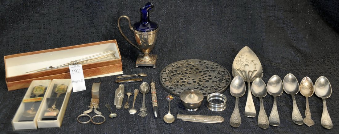 Lot of Miscellaneous Silver Dinnerware: To include: mixed souvenir spoons, cheese knives and servers, Towle pie server, and others. Approximately 11.40 troy ounces of sterling.