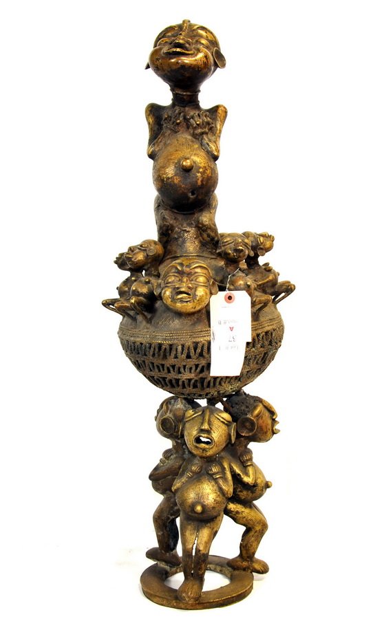 African Bronze Altar: Bamileke Bronze Altar Piece consisting of pierced sphere surmounted by single tall figure surrounded by many small faces and figures, 19th century Mali measures 32"