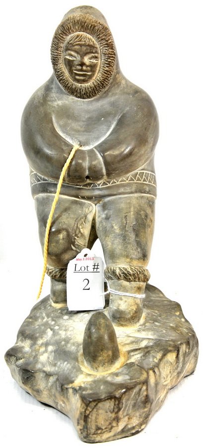 Chalk figure of Eskimo looking: at a seal coming out of a seal hole, 10" x 8", signed on base "Abbott", Canada