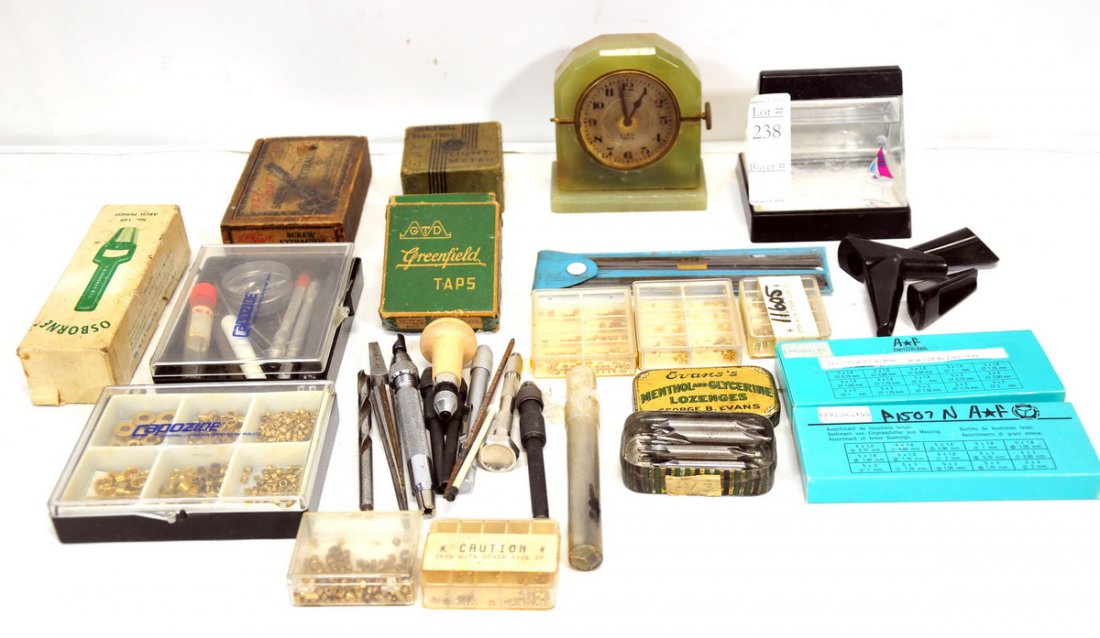 Assorted Clock parts: Small bushings, GE light meter in original box, Tap sets, Ezy out set, and much more