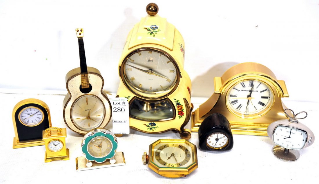 Collection of 9 Small Clocks: Howard Miller Clock, TV Clock, Guitar Clock and more