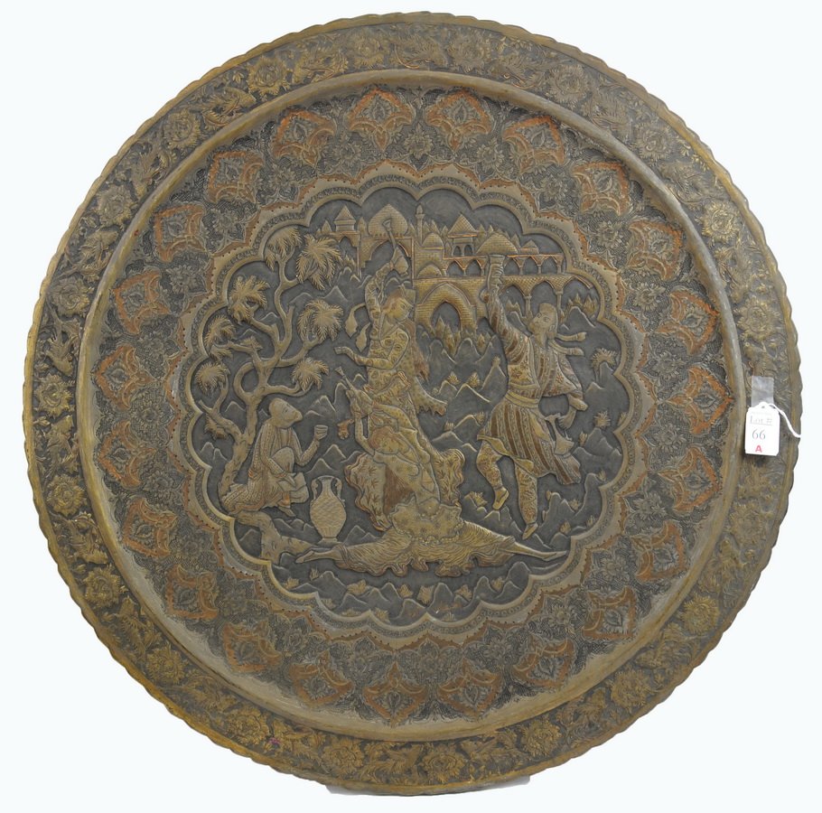 Large decorative Persian/Indian copper charger: This large very ornate charger is 26 1/2" in diameter. It displays four figures in a ritual dance with trees and onion domed buildings in the background. It appears to be made out of copper with brass