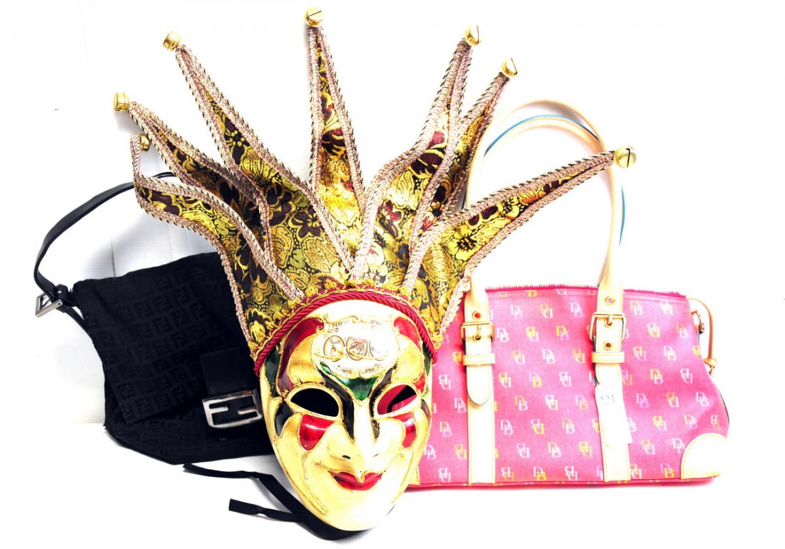 Lot of Designer Bags and Mardi Gras Items: Lot includes two designer handbags, one black cloth Fendi bag and one Dooney and Bourke classic handbag in pink. Lot also includes an elaborate Mardi Gras mask and three signed, numbered Mardi Gras po