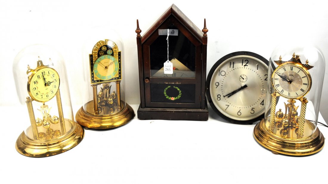 Misc. Clock Lot: Lot includes 5 clocks: a Seth Thomas mantle clock, 3 brass and glass dome clocks, and a 1939 wall clock with an 8" face.