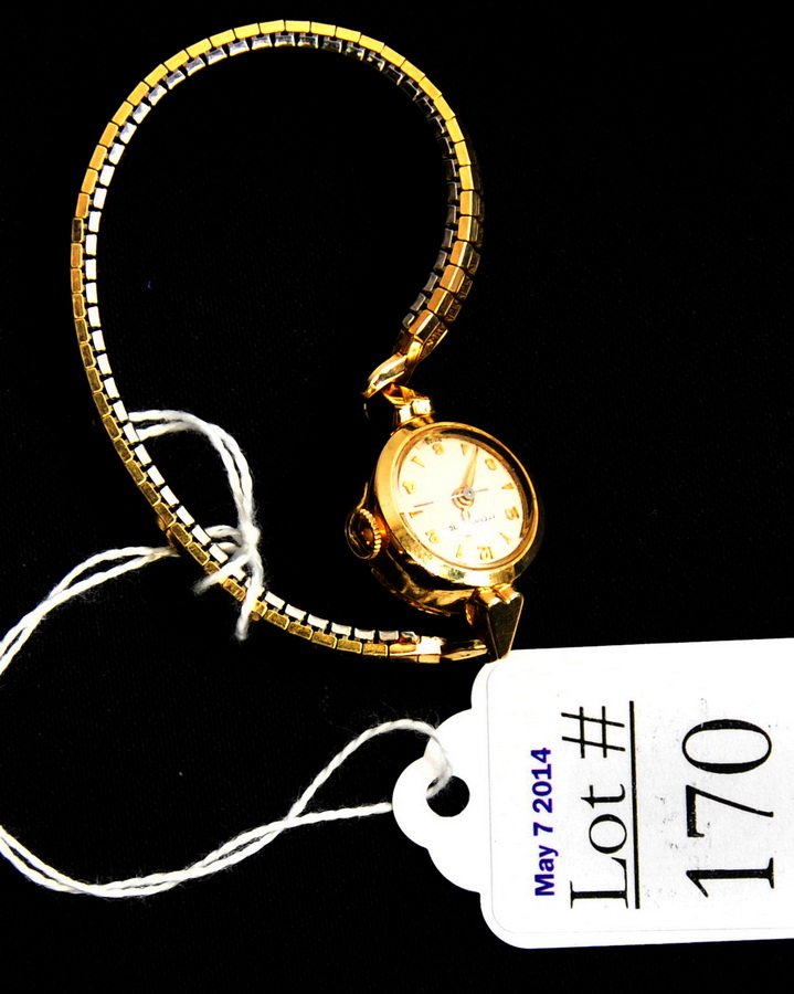 Lot of 2 Vintage Watches: One lady's Eterna Matic watch and one men's Longines watch with black leather band in running condition.