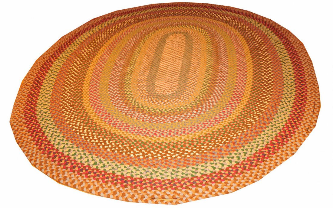 Vintage 8' X 9' Braided Rug in Earth Tones: Rug is in good condition for age, just needs restitching at a few seams. Warm earthy colors: reds, yellows, greens, browns, and gray/blue.