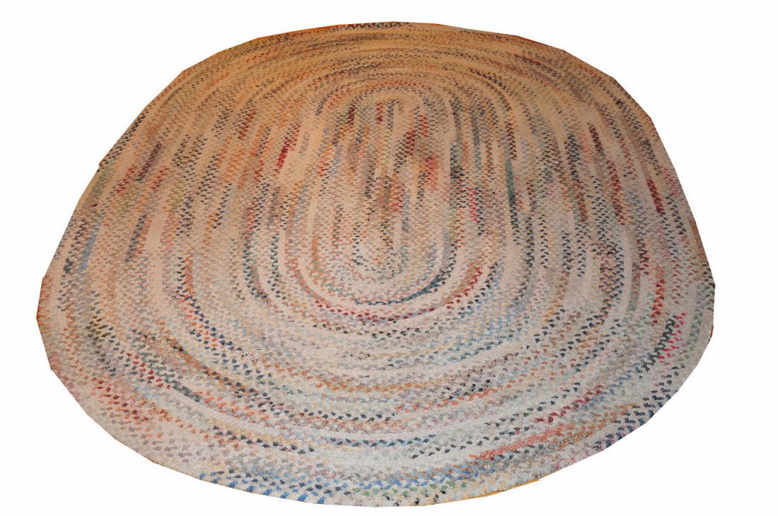 Vintage 61.5" X 95.5" Braided Rug: In worn but solid condition, in pinks, reds, off white, blues, and rust.