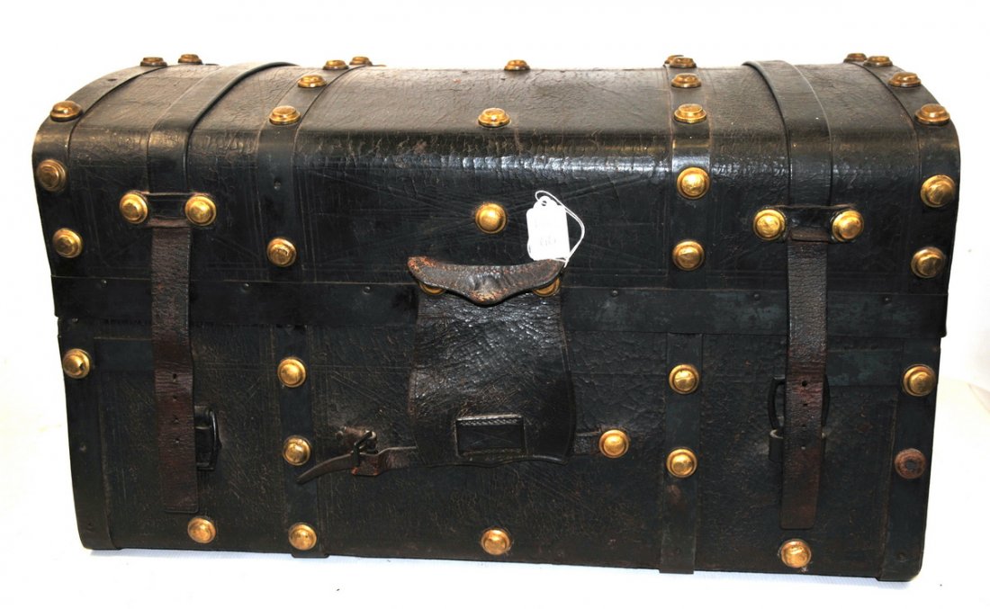 Mid 19th C Jenny Lind Trunk: This beauty is in very good condition for its age, with dark leather and iron bands with "gold nugget" brass studs, and with leather straps and hardware intact except for a few studs. It was manufactu