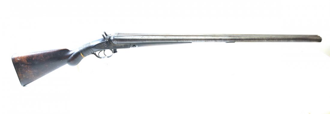 Parker Bros. Under Lifter Hammer 12 Ga.: Parker Under Lifter Hammer Side by Side Double Barrel Damascus 12 Gauge Shotgun. Lots of engraving. Has a old repair to the wrist.