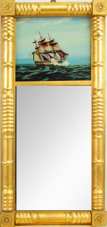 29" X 14" Federal Mirror w/ Painting of Ship: Mirror is painted gold, with a hand painted top depicting a full masted frigate with American flag and canons booming on the high seas.