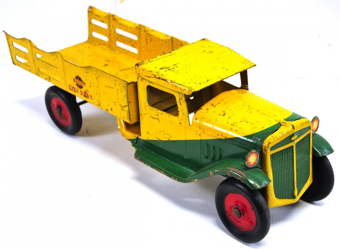 Early Buddy "L" City Dray Truck: Measures approx. 20" long, 6.5" high, and 6" wide; painted yellow and green with red wheels.
