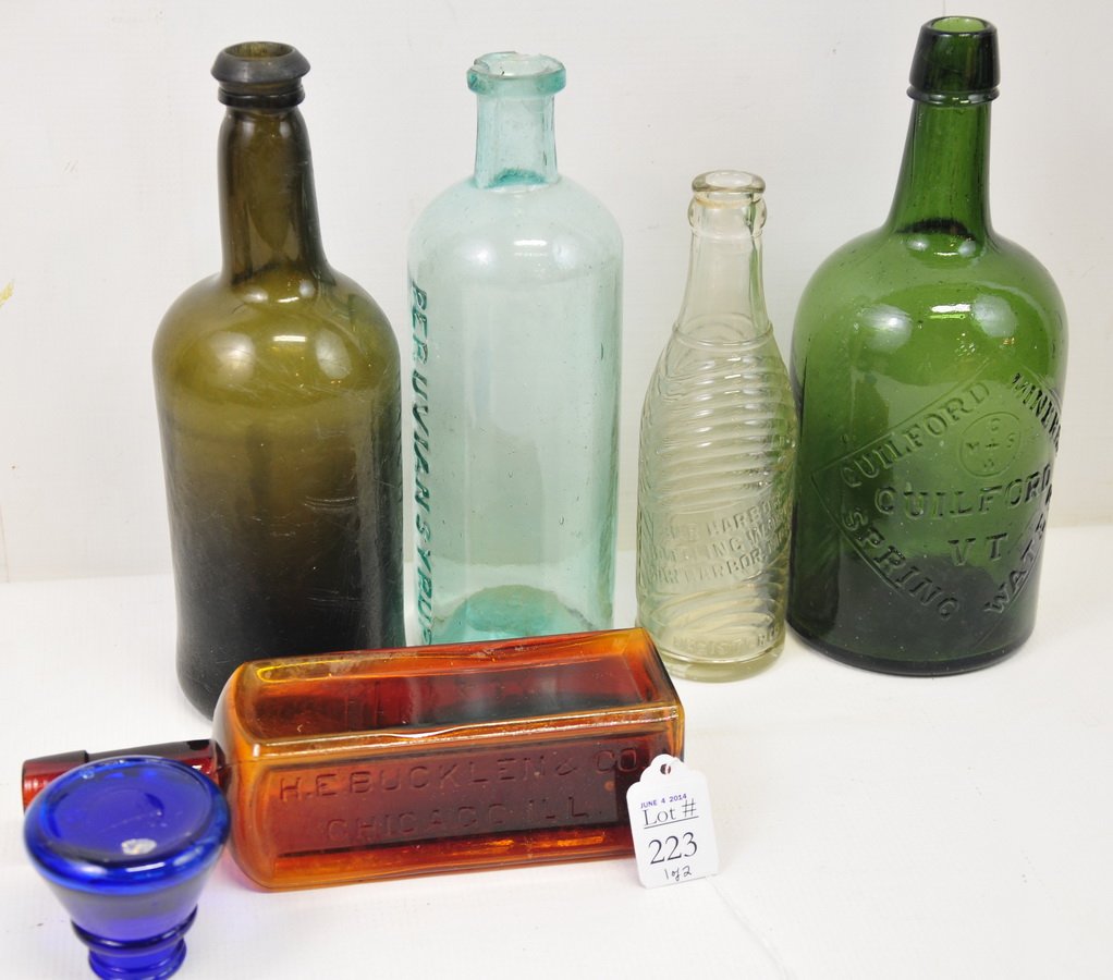 Lot of Antique Bottles and Glass Smalls: Lot contains 10 antique and vintage bottles, including a Winchester Oil bottle, The Babe's Companion bottle, Bar Harbor Bottling Works, large Spring Water bottle from Cuilford, VT, Puruvian Syrup, and