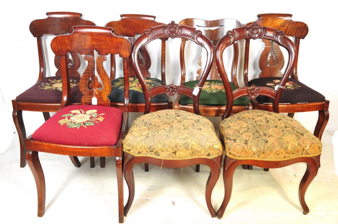 Lot of 7 Walnut Victorian Side Chairs: Includes 5 chairs with needlepoint seats, 4 matching (one broken), all measuring approx. 33.5" high, 17.5" wide, and 19" deep. Also includes 2 balloon back chairs measuring approx. 34.5" high, 18" wid