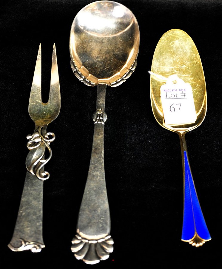 3 Sterling Serving Utensils: One spoon with enamel stem signed Norway Sterling, Fork signed Cohr Sterling Denmark, and serving spoon marked Maria on handle. 7.55 ozt.