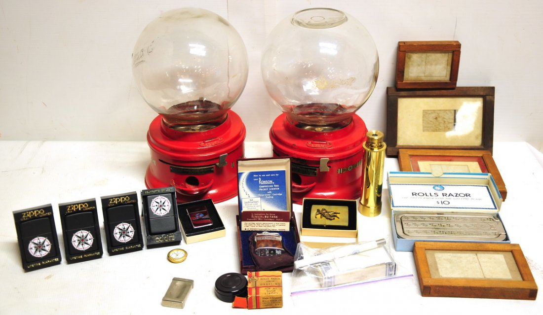 Discovery Lot of Smalls: To include: two vintage Ford bubble gum machines, collection of Zippo lighters, Kodak Eastman wooden frames, and others.