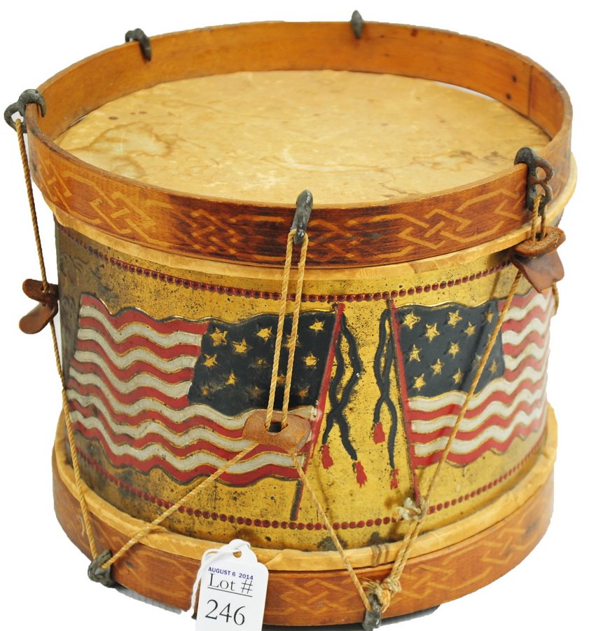 Vintage Wood and Tin Toy Drum: Decorated with 13-star American flags, measuring approx. 8" X 10." Some stringing has been reinforced with a rubber band.