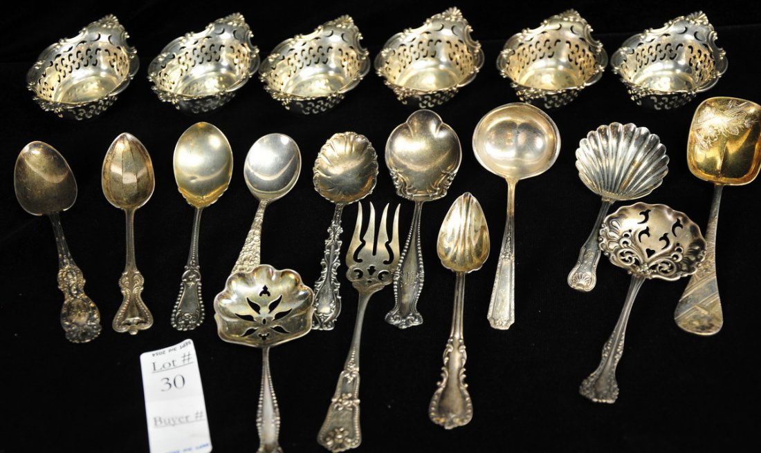 Sterling Silver Serveware Lot: To include a set of 6 sterling reticulated nut dishes measuring approx. 2.5" X 4," plus 13 decorative sterling spoons, ladles, forks, etc. Towle, Wallace, Kirk King, Wood & Hughes, F. Whiting, Alvin,