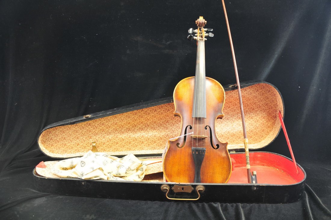 Violin with a label inside reads Joleph: Fitcher, 1818 "Joseph Fischer, German b. 1769 - d. 1834". Has bow and wooden carrying case. Violin is 21 1/2" L , condition is good, estate fresh find.