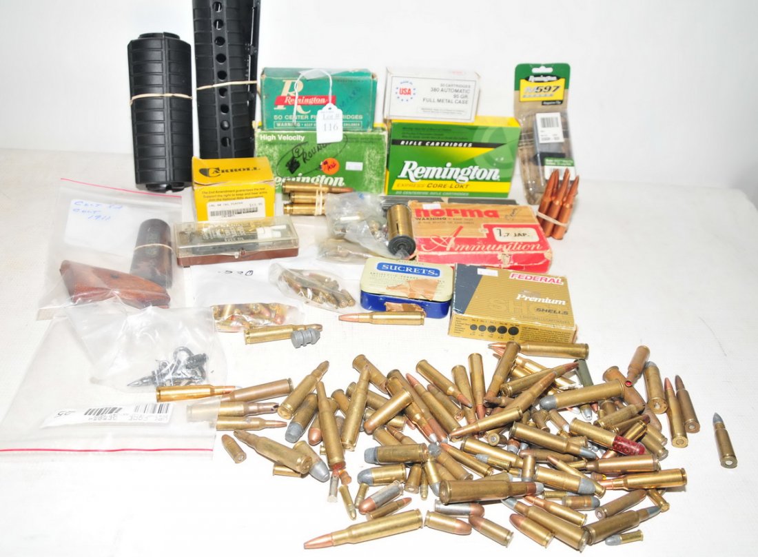 Collection of Ammunition and Shooting Items: Including 38 Caliber rounds, Jap 7.7 Rounds, 40SW Hollow Points, 12 Gauge Shells, 250 Savage Rounds, 32 Longs, Misc. Loose Rounds, 380 Rounds, Stripper Clips, 30-06, with wooden Colt 1911 Grips, loade