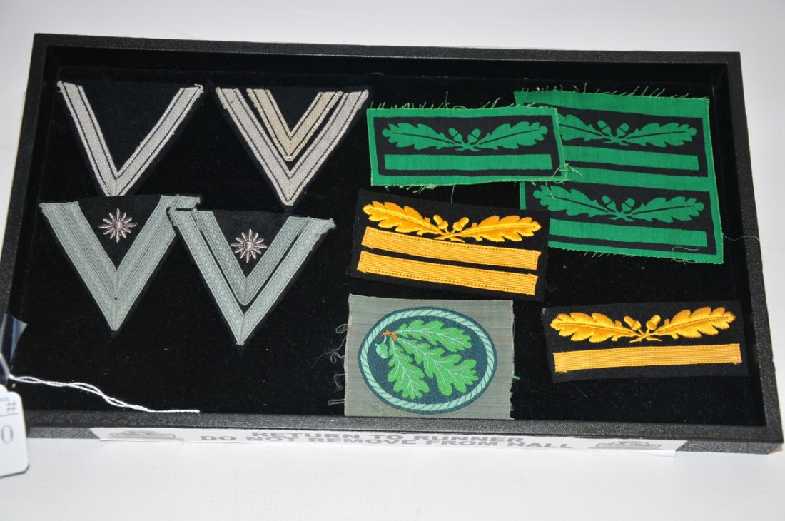 Waffen SS cloth insignia: Collection includes Waffen SS two year service chevron and 8 year service chevron, 3 Obersturmbannführer (Lt Col.) Paratrooper Green & Black Silk Sleeve Rank Insignia. Gruppenfuhrer/Generalleutnant G