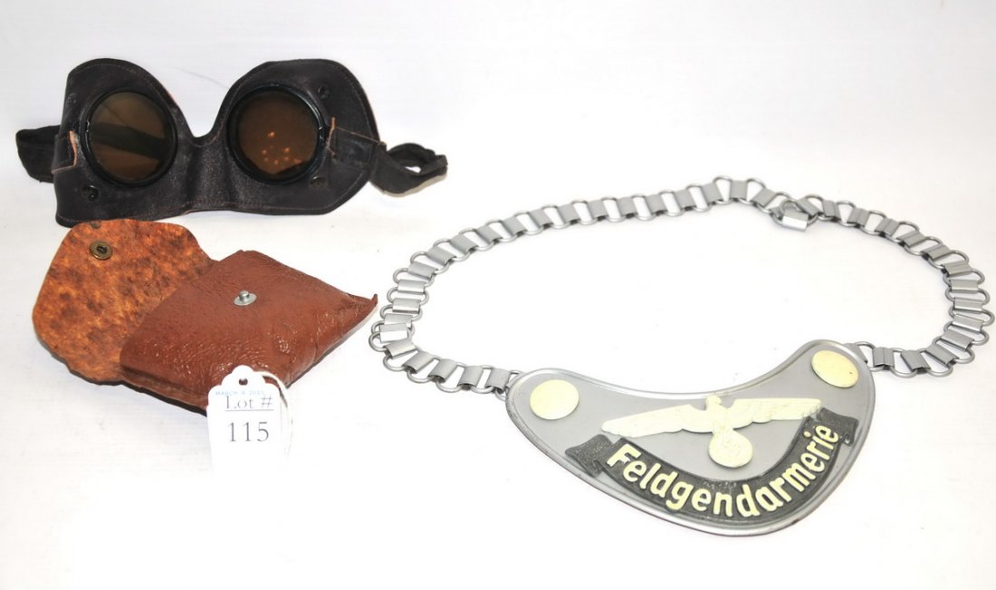 Nazi Military Police Gorget: This is a RARE German Army Military Field Police gorget. It has the Army eagle painted with radium paint with radium painted buttons for the chain attachments. The banner is black enamel with