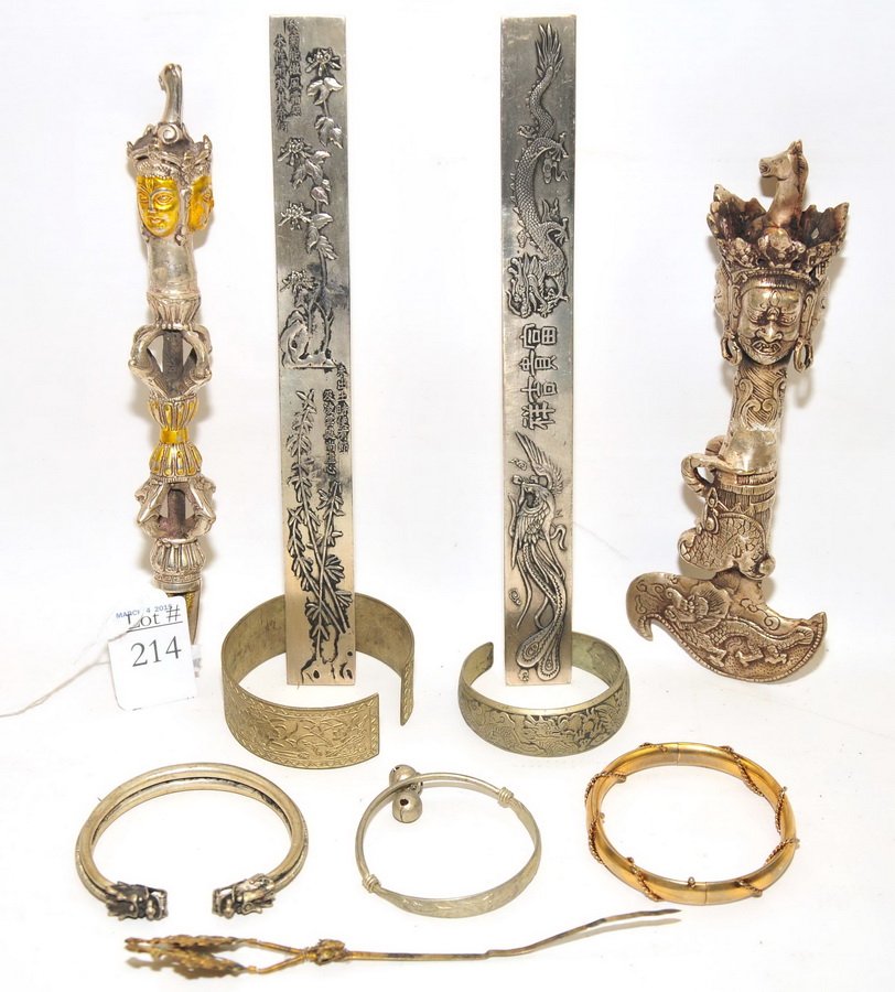 Collection of Asian items to include:: two Chinese silver daggers, two Chinese silver paper weights, a hair pin and five bracelets.