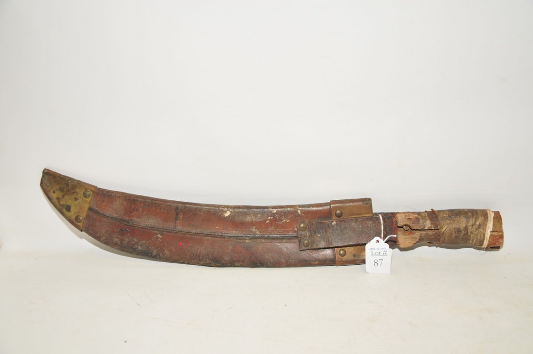 COLLINS & CO. MACHETE, WOOD HANDLE, C1918:: This Machete includes the leather scabbard. The blade is marked Collins and Co. US. The Wood handles are in rough shape.