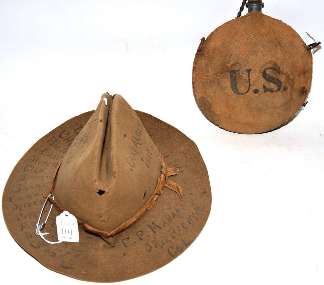 Identified Spanish American War Hat and Canteen: The hat and U.S. canteen from the Spanish American War belonged to E. MaHan. of company L, 3rd N.Y.V. Infantry, which the soldier personalized with his buddies names. Also listed on the hat are the ca