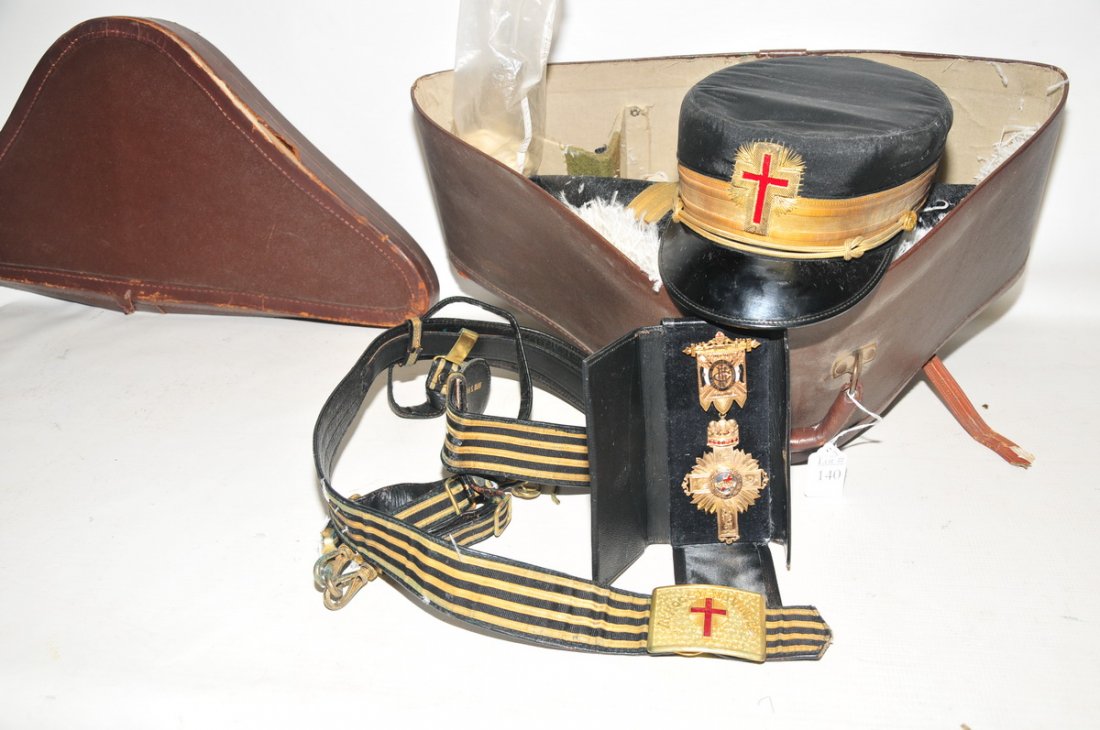 Fraternal Order regalia in carrying case: including In Hoc Signo Vinces medal owned by James W. Devine 1957 from the Portland Comedy No. 2 Fraternal 1948-1949, Free Mason Masonic cap with white gloves and Fraternal Bicorn Hat and sword belt w