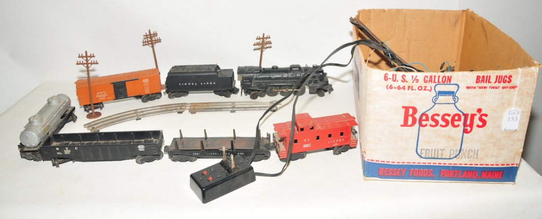 Collection of post war Lionel trains: and tracks to include orange New York Central System (NYC) 159000, red caboose LIONEL 6257, silver Sunoco gas car built by Lionel, a black engine car #2026 and more.