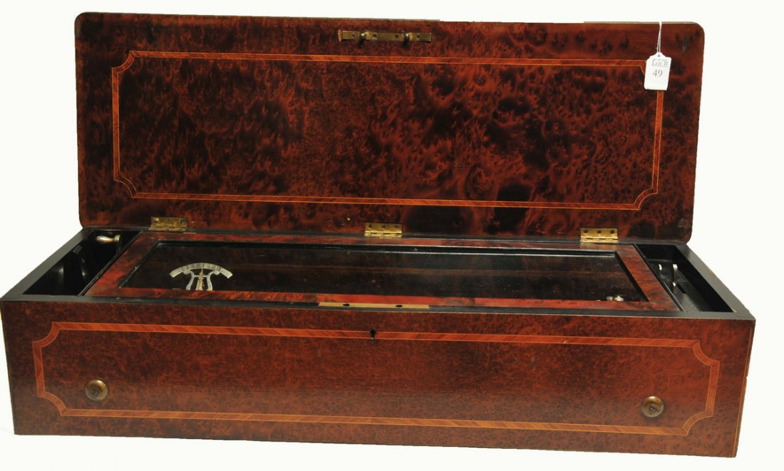 Beautiful Antique Swiss Music Box: In excellent condition, beautiful sound and clarity, functions well. Measures 30" in flame mahogany case. Case does have small areas of wear and character