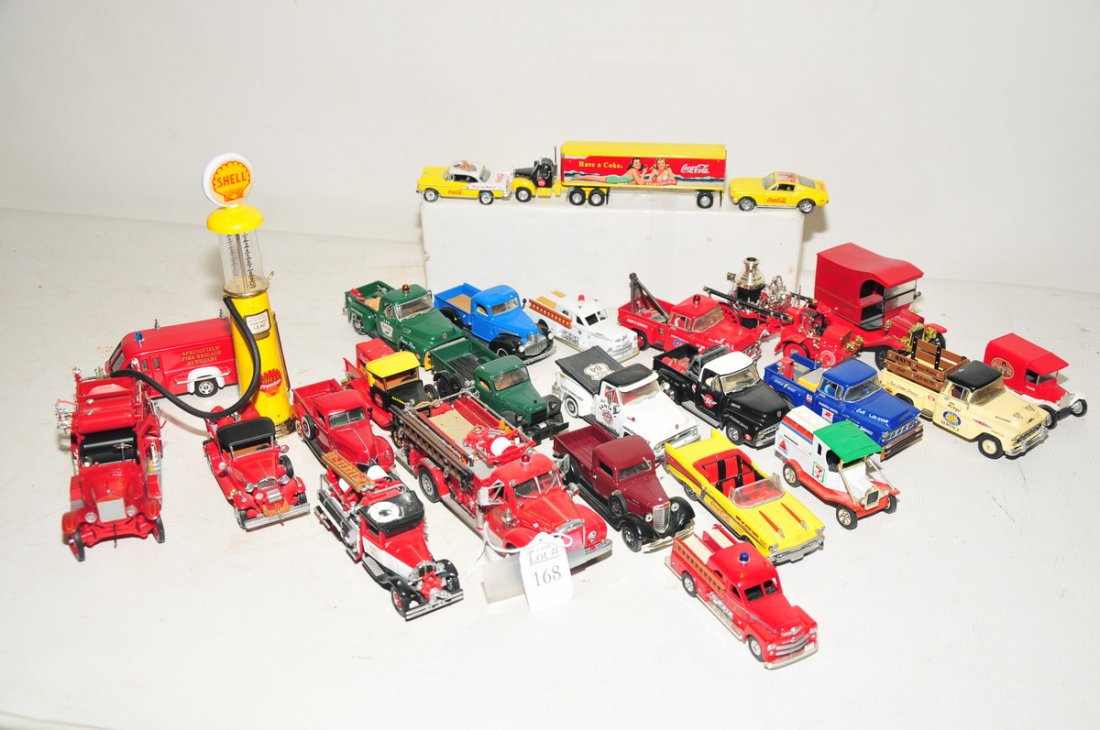 Collection of toy trucks: with Coca Cola vehicles, pick ups and fire trucks, mostly reproductions. Tonka red Volkswagen Beetle # 52680 has metal body, plastic wheels and bumper, metal undercarriage 8" - 9", Nylint yellow hot r