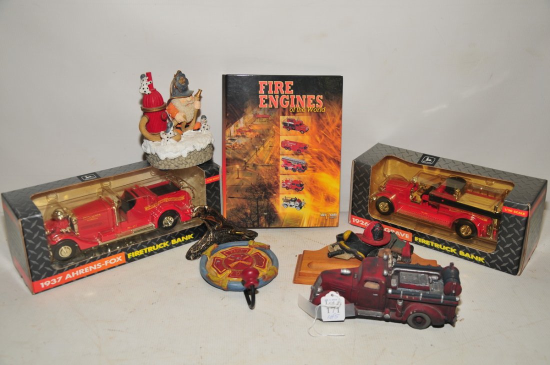 Large collection of fire trucks: three firetrucks in original boxes, small scale ladder and old fashioned trucks along with other fire memorabilia. Great for the fire truck collector!